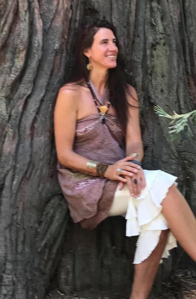 Kirtanista Beloved Pure-love is wearing off white.